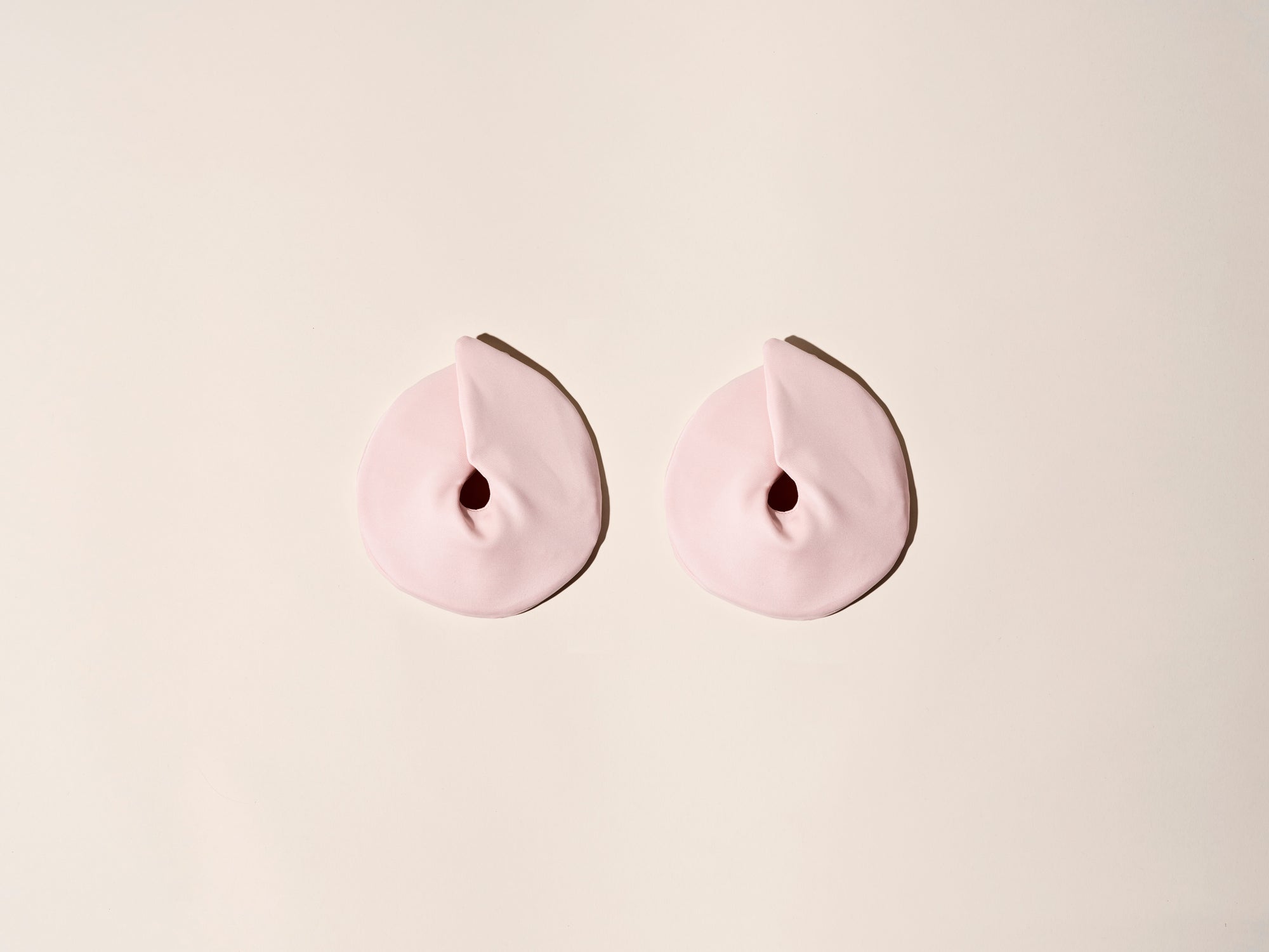 Borstkompressen in de wasbare hoezen die warm de toeschietreflex stimuleren